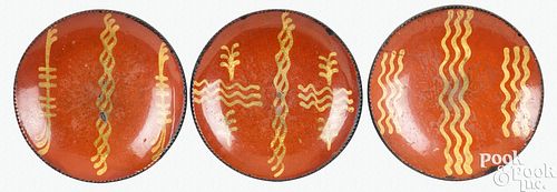 THREE PENNSYLVANIA REDWARE PLATES, 19TH