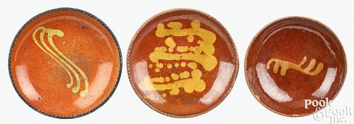 THREE PENNSYLVANIA REDWARE PLATES, 19TH