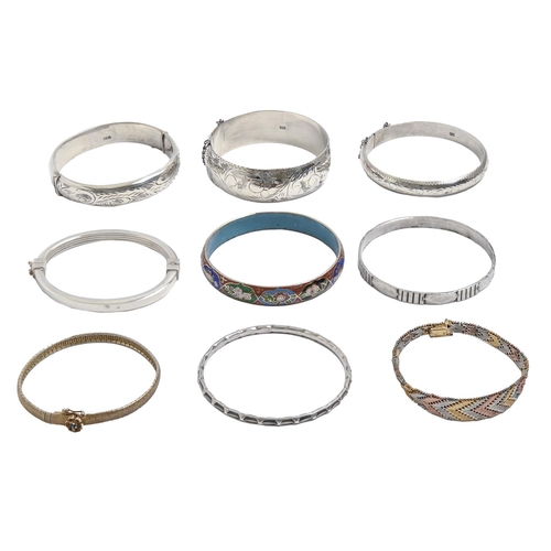 Seven silver bangles, one enamelled