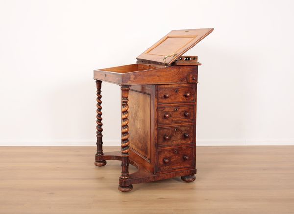 A VICTORIAN WALNUT DAVENPORT with pierced