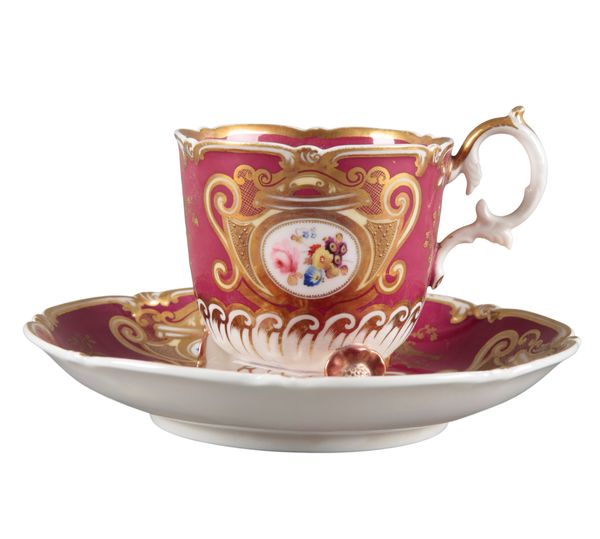 AN H & R DANIEL C-SCROLL CUP AND SAUCER