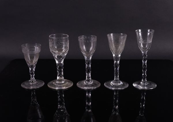 FIVE ENGRAVED FACET STEMMED WINE GLASSES