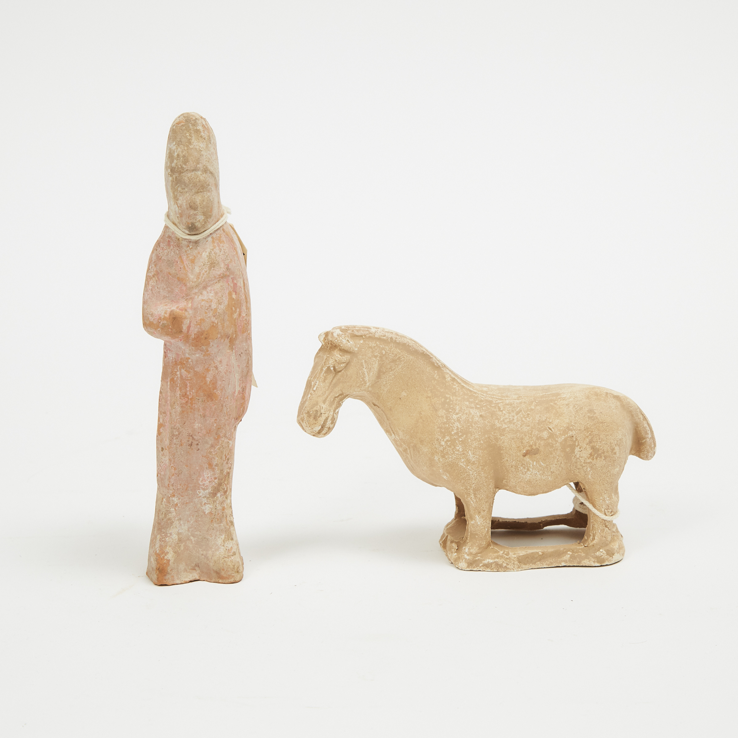 Two Small Pottery Figures of a Man and