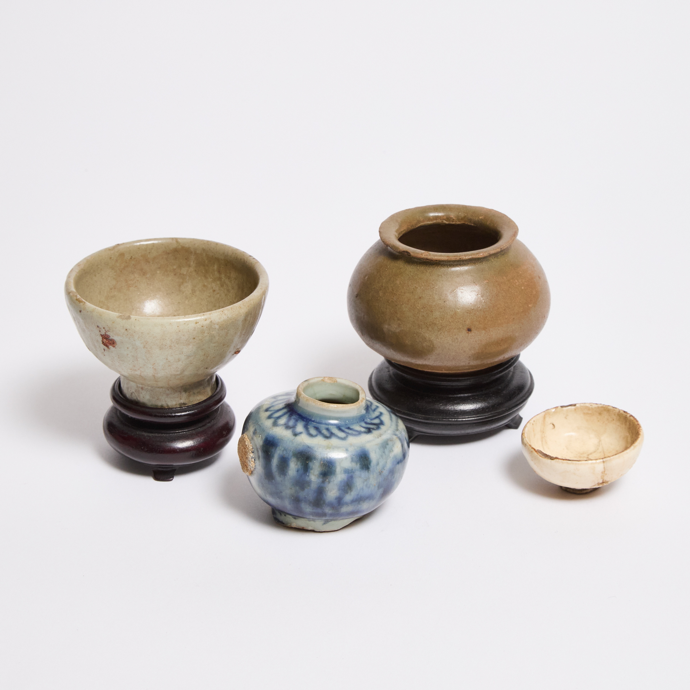 A Group of Four Small Stoneware Vessels,