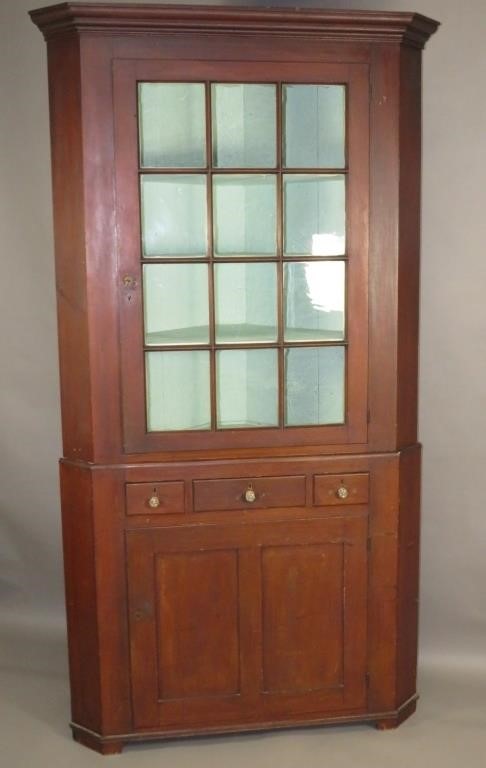 TWO-PART CORNER CUPBOARDca. 1830; in