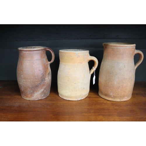 Three antique French stoneware jugs,