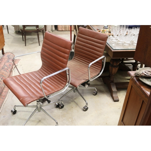 Pair of Eames style swivel office chairs