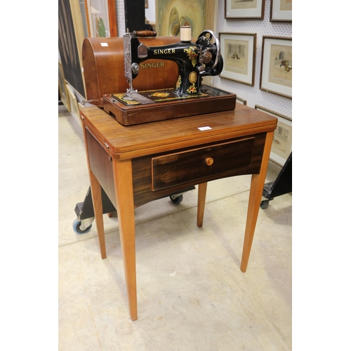 Singer sewing machine on table  2fb1820