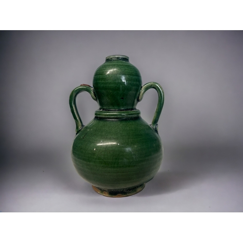 A Chinese green glazed twin hand 2fb1a32