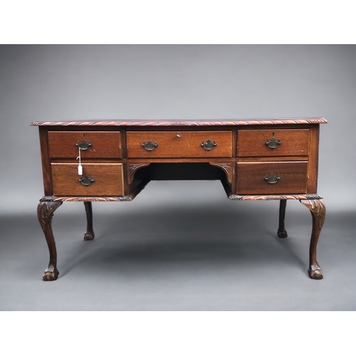 A 20th Century Mahogany Desk, with dragoon