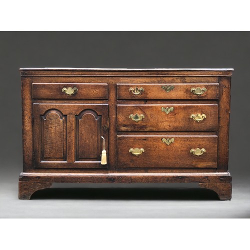 AN early 18th century Oak side cupboard.Plank