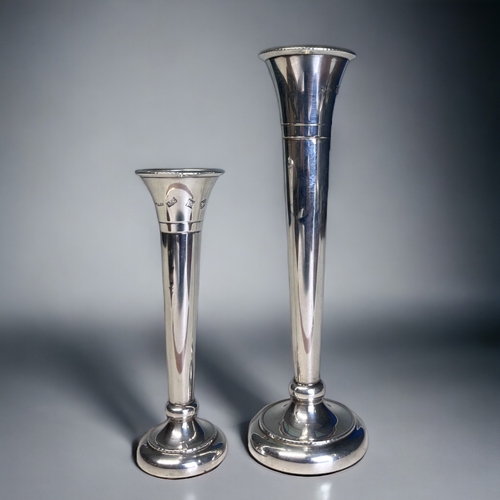 A pair of sterling silver stem vases.A.T