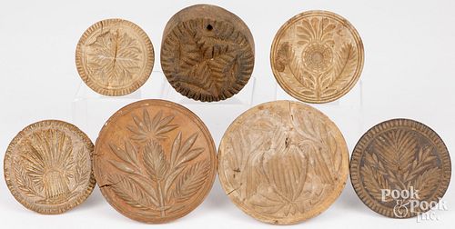 SEVEN CARVED BUTTERPRINTS, 19TH C.Seven