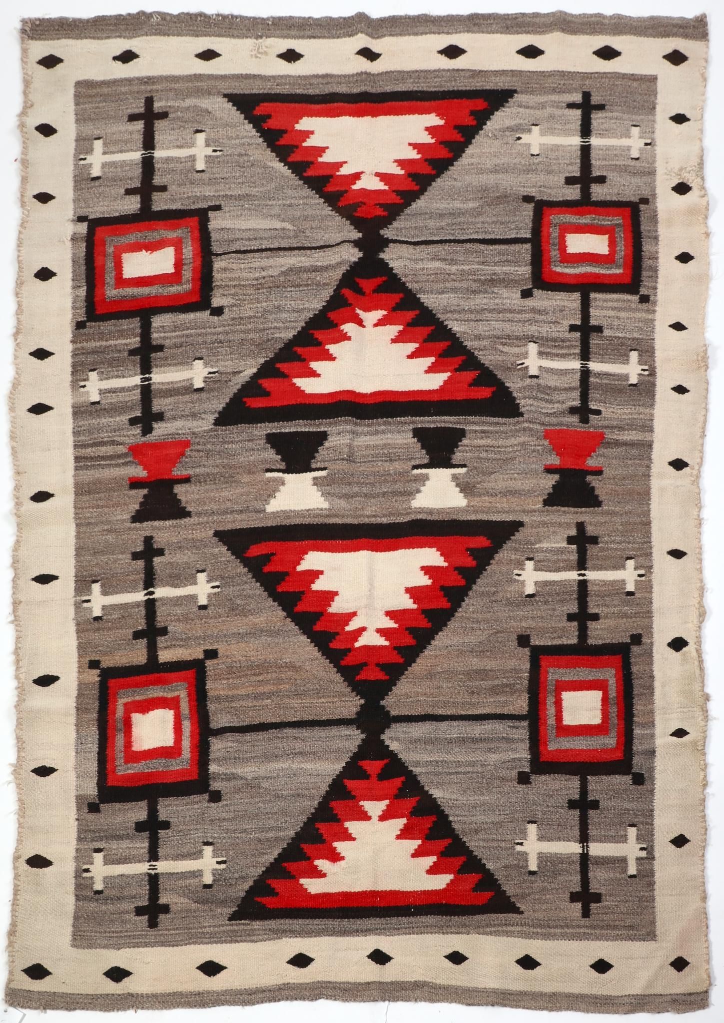 A NATIVE AMERICAN WOVEN RUG, NAVAJOA