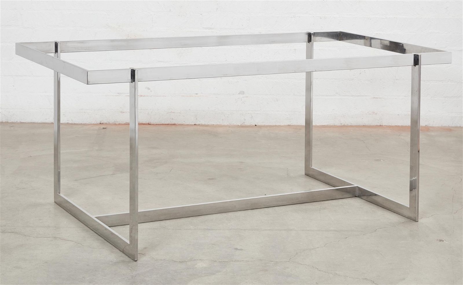 A MODERNIST STAINLESS STEEL TABLE 2fb2750