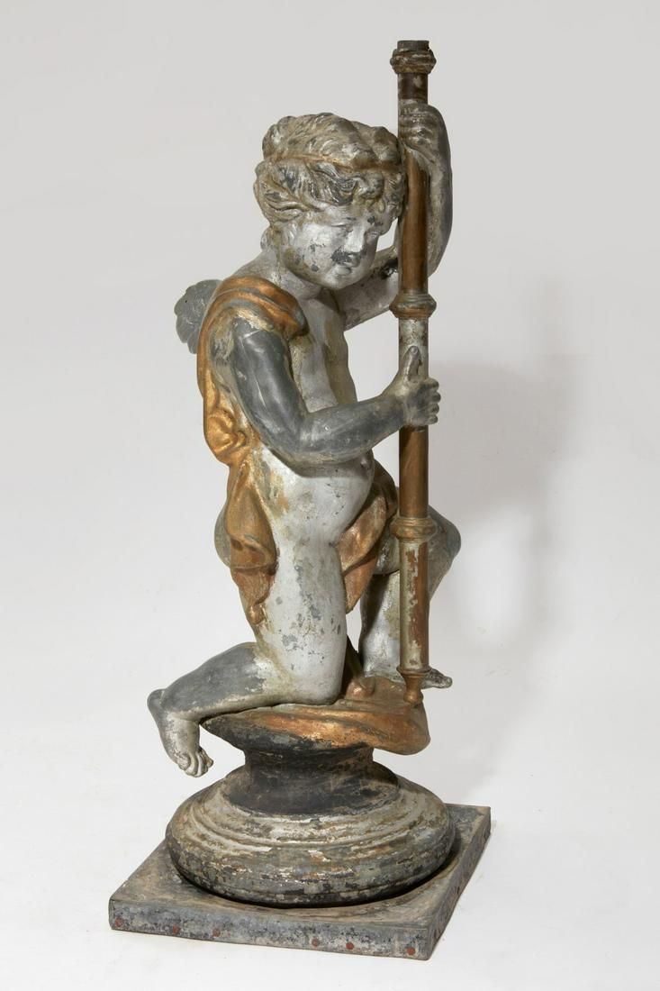 A CONTINENTAL SILVERED MODEL OF A KNEELING