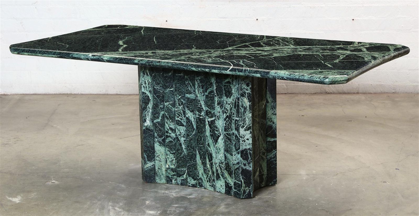 A MODERN VARIEGATED GREEN MARBLE DINING