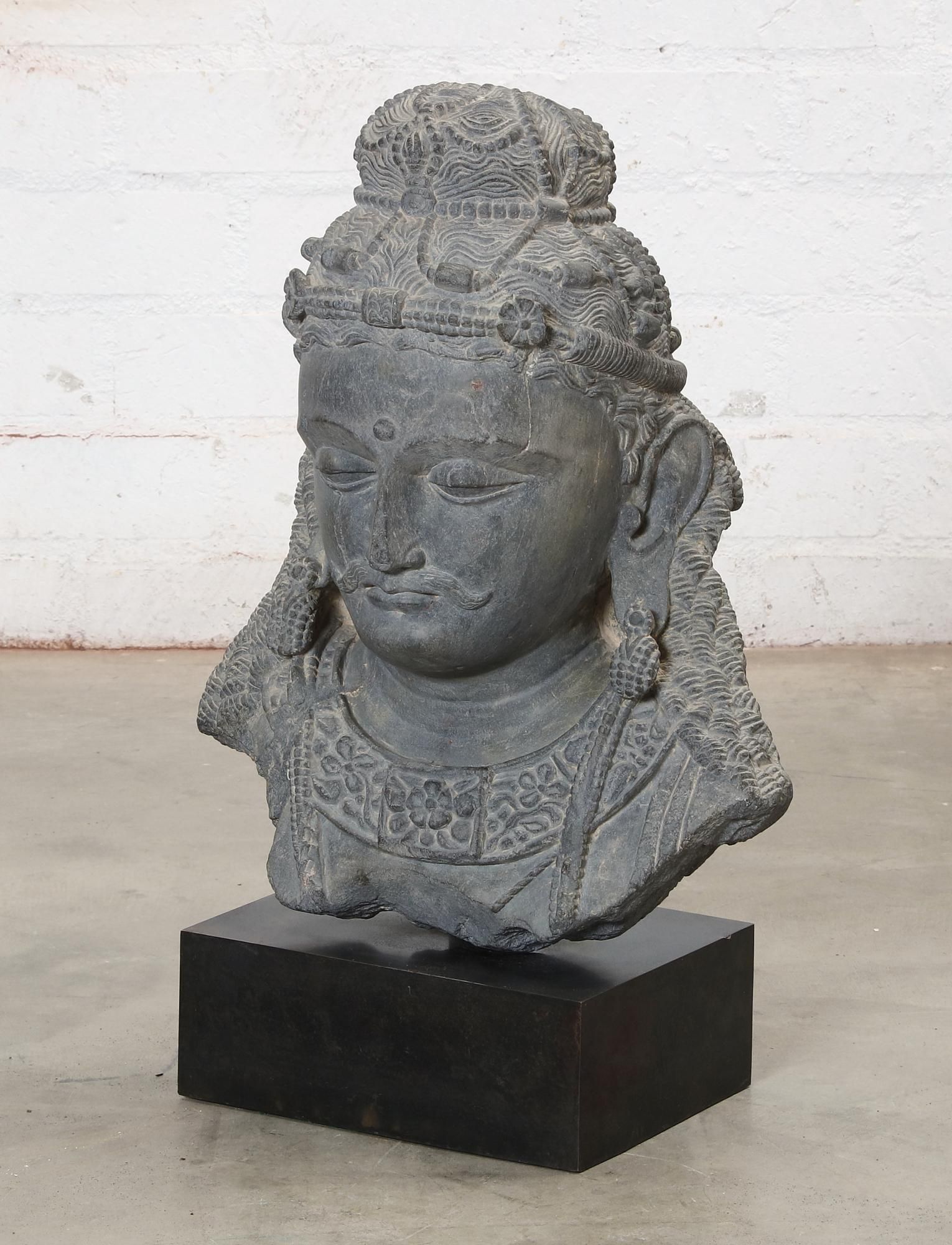 A SOUTHEAST ASIAN SCHIST HEAD OF A BODHISATTVAA