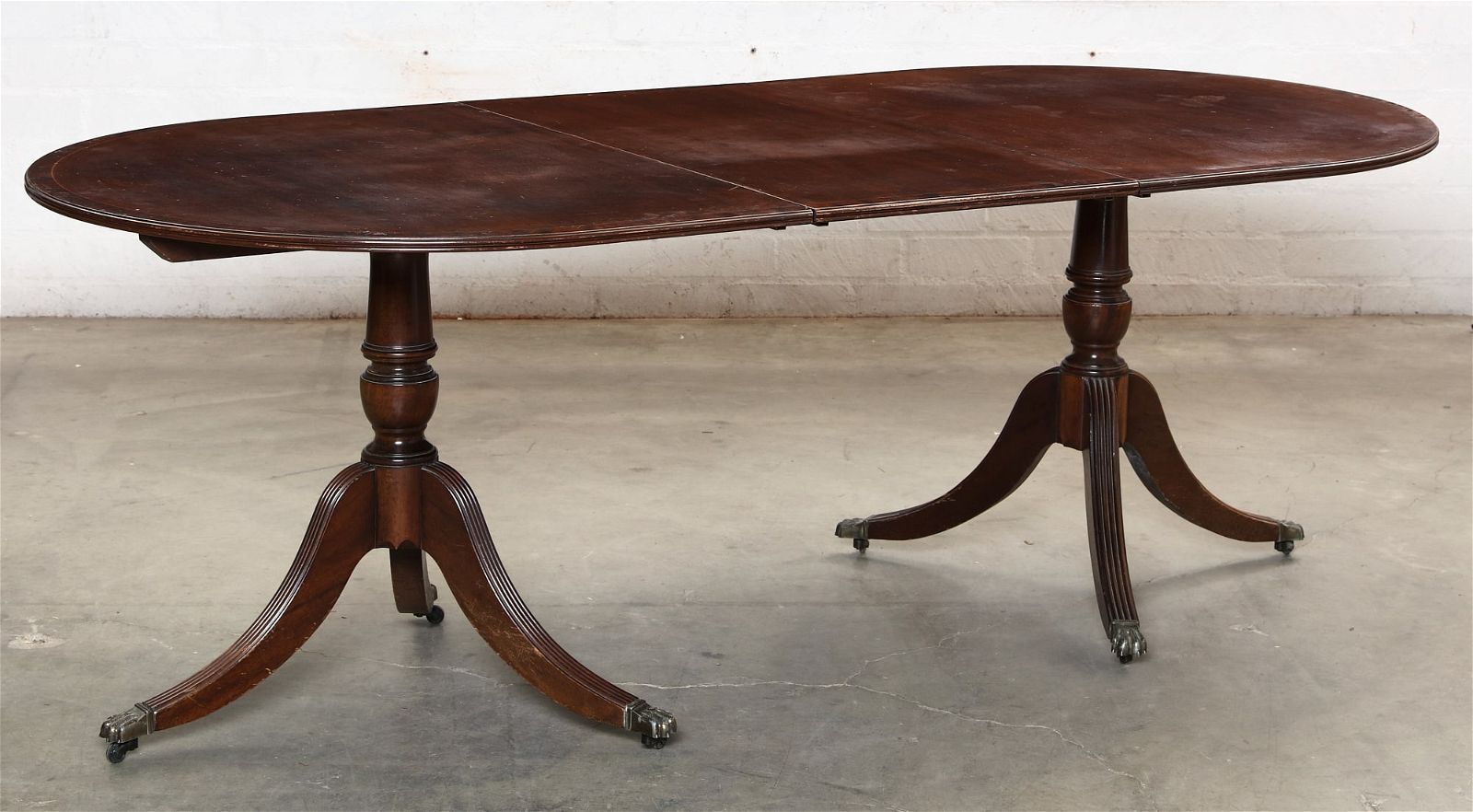 A GEORGE III STYLE TWIN PEDESTAL DINING