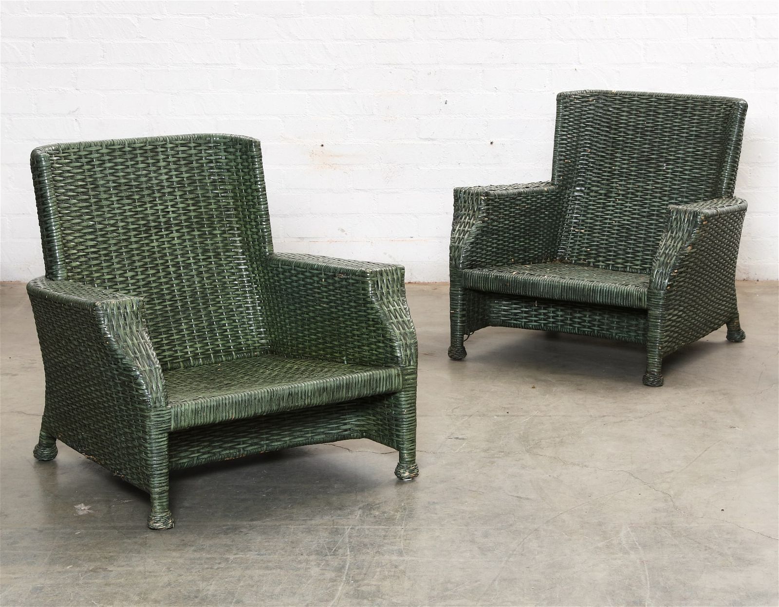 A PAIR OF MCGUIRE WOVEN RATTAN ARMCHAIRS,