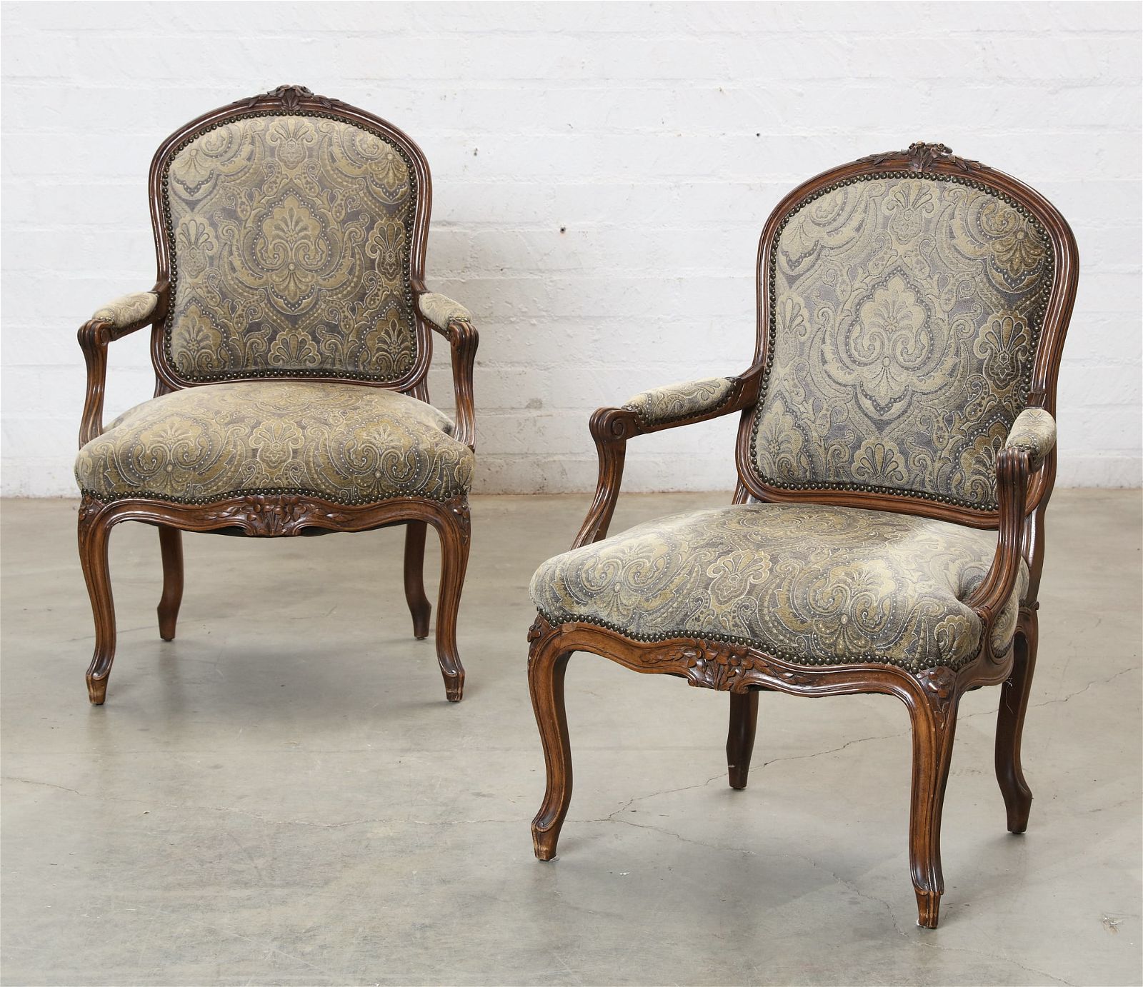 A PAIR OF LOUIS XV STYLE  WALNUT FAUTEUILSA