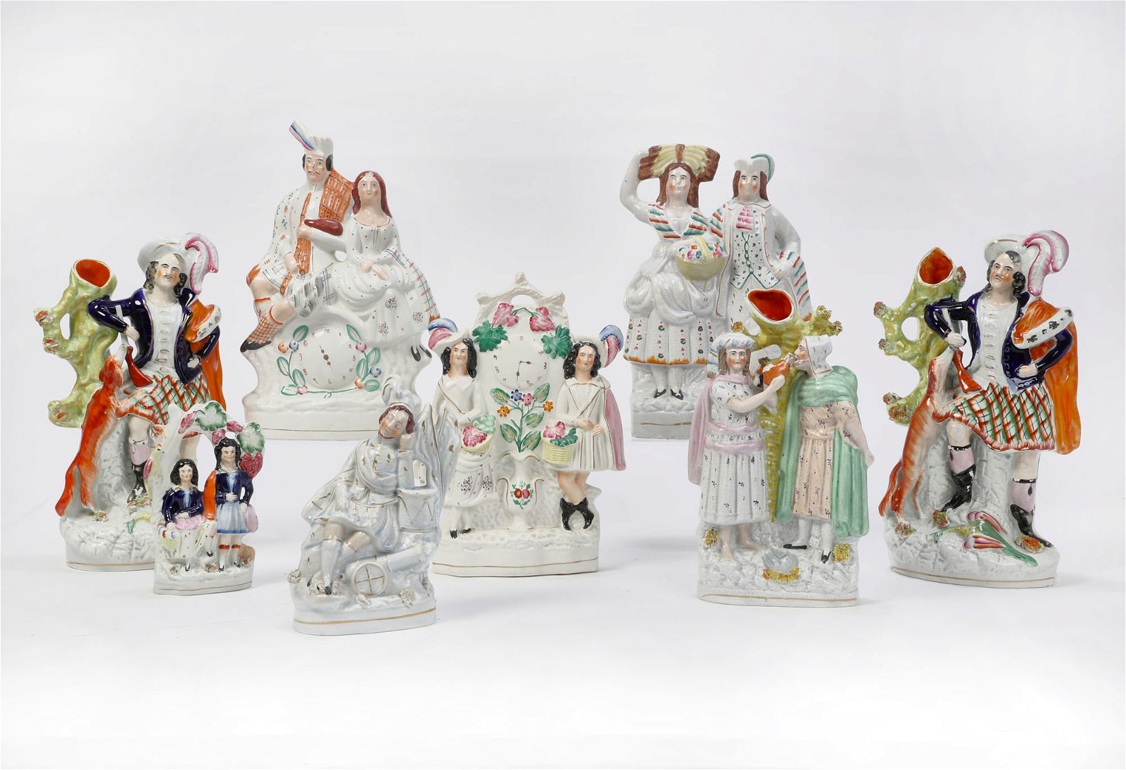 EIGHT STAFFORDSHIRE FIGURES AND FIGURAL