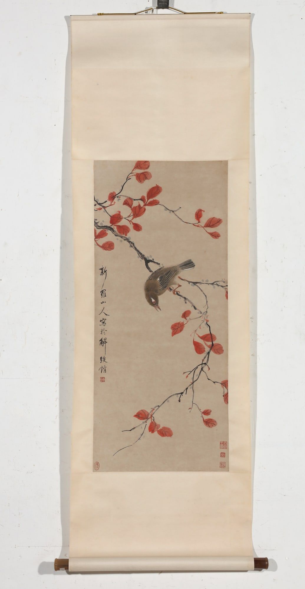 A CHINESE SCROLL DEPICTING A BIRD ON