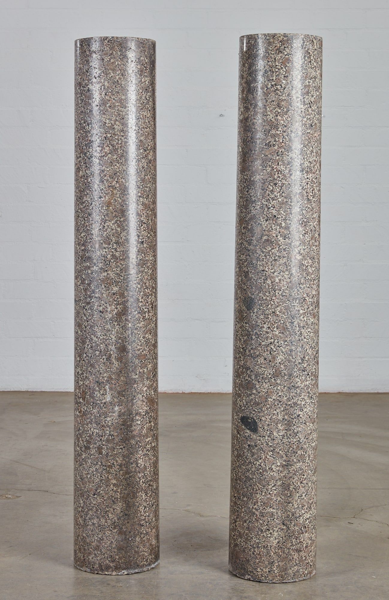 A PAIR OF GRANITE COLUMNSA pair of granite