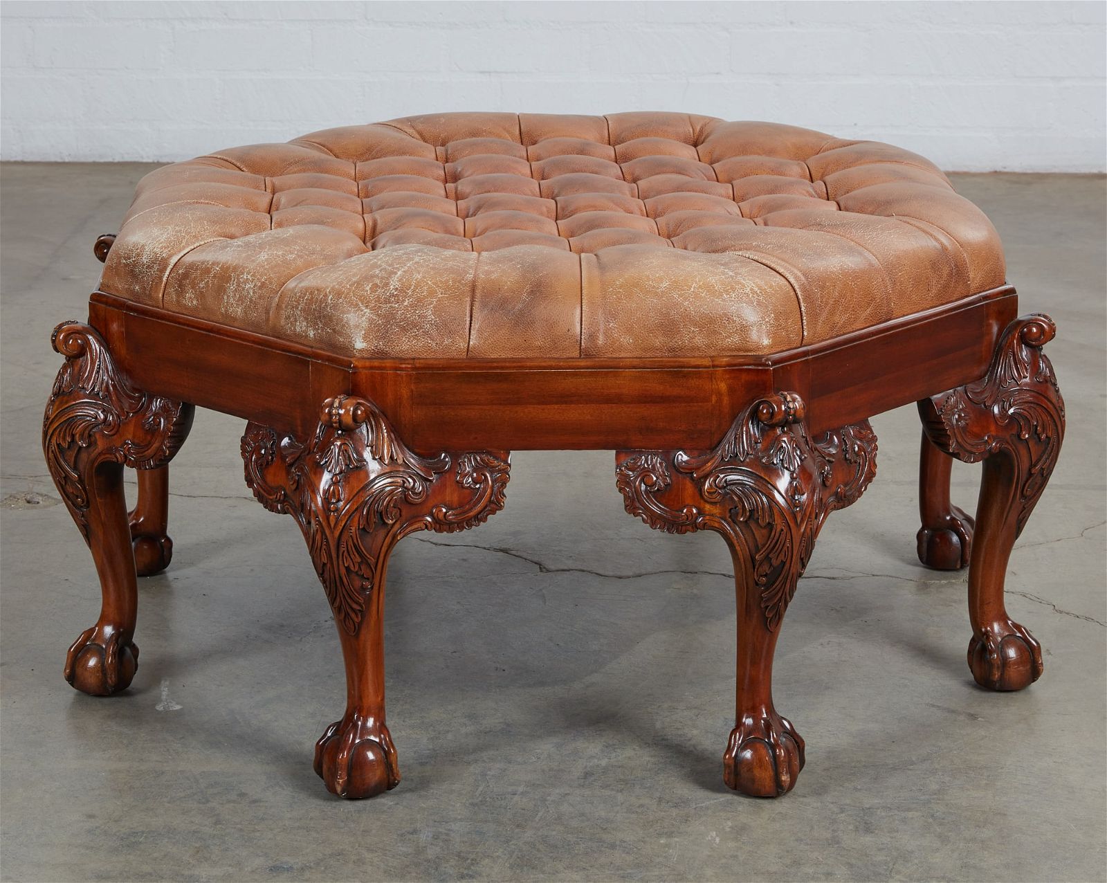 A GEORGE II STYLE OCTAGONAL OTTOMANA