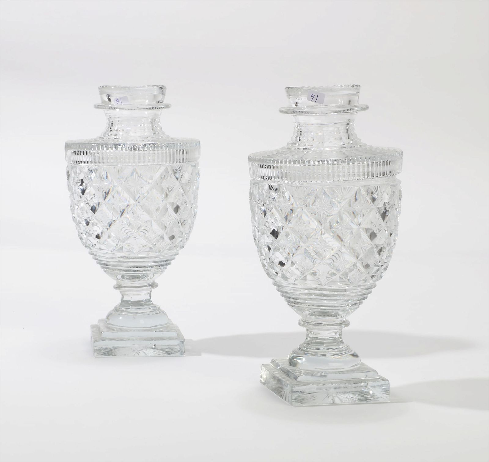 A PAIR OF ENGLISH CUT GLASS COVERED 2fb3523