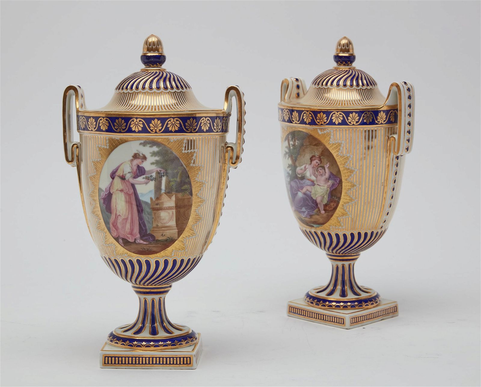 A PAIR OF DERBY PORCELAIN HANDLED COVERED