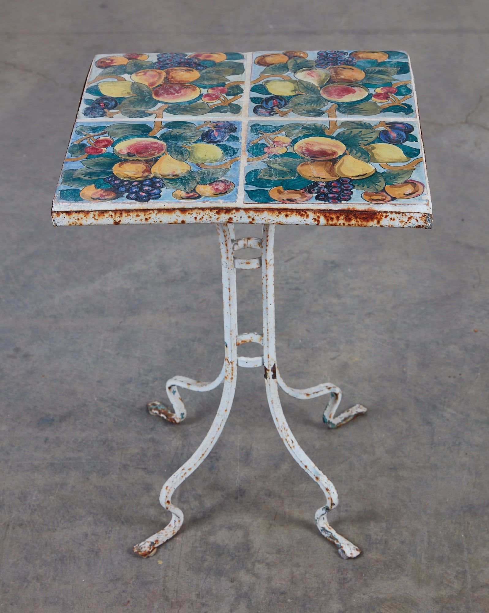 A WROUGHT IRON TILE TOP TABLE, 20TH