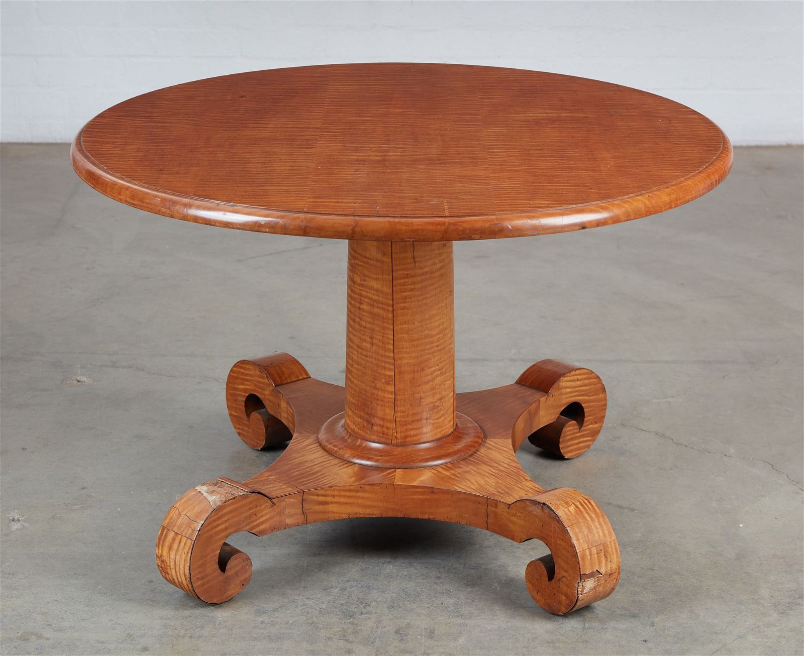 AN EMPIRE STYLE TIGER MAPLE PEDESTAL