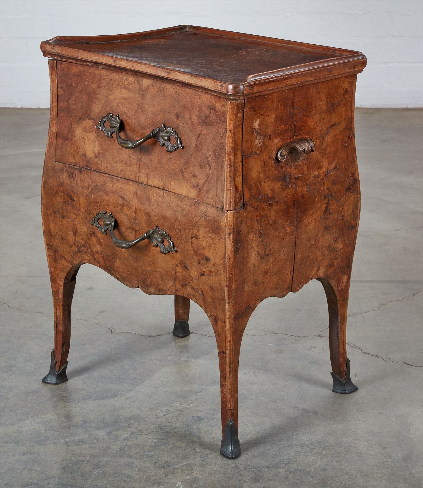 A SOUTH GERMAN ROCOCOBURR WALNUT BEDSIDE