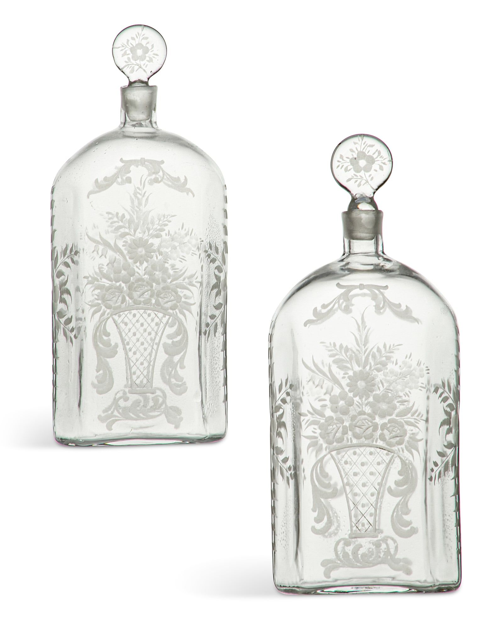 A PAIR OF CONTINENTAL DECANTERS AND