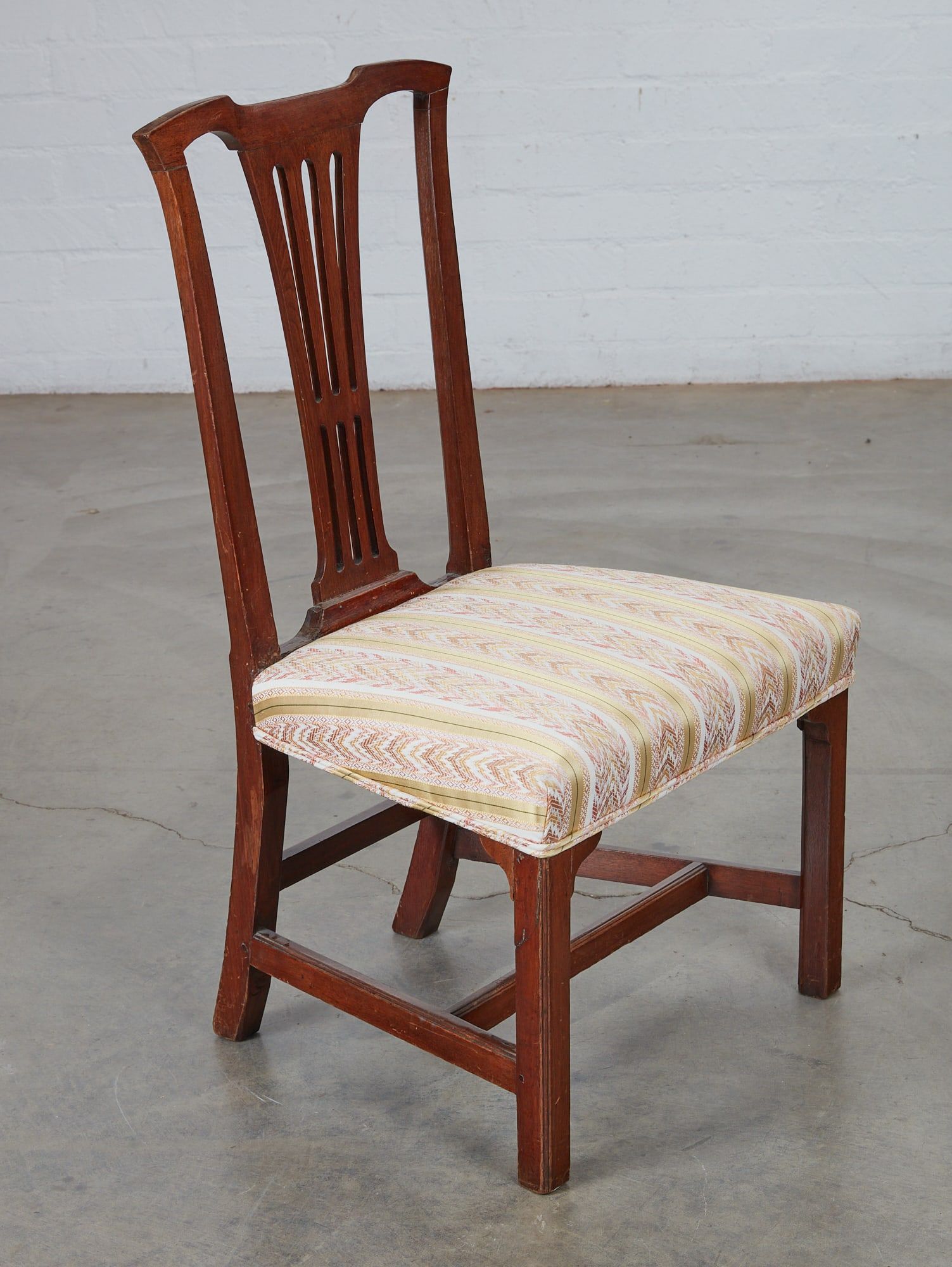 A CHIPPENDALE MAHOGANY UPHOLSTERED SIDE