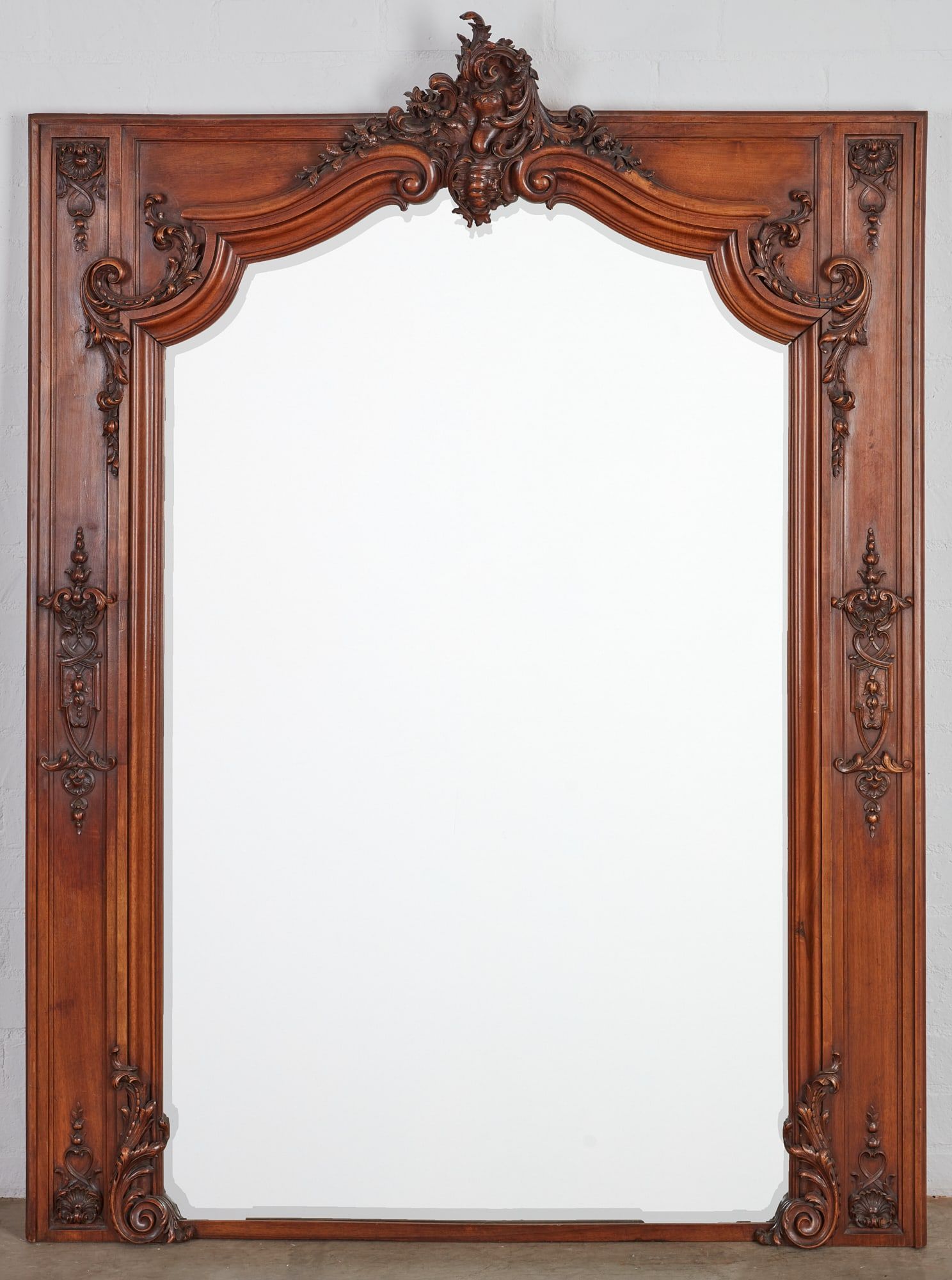 A REGENCE STYLE WALNUT MIRROR, 20TH