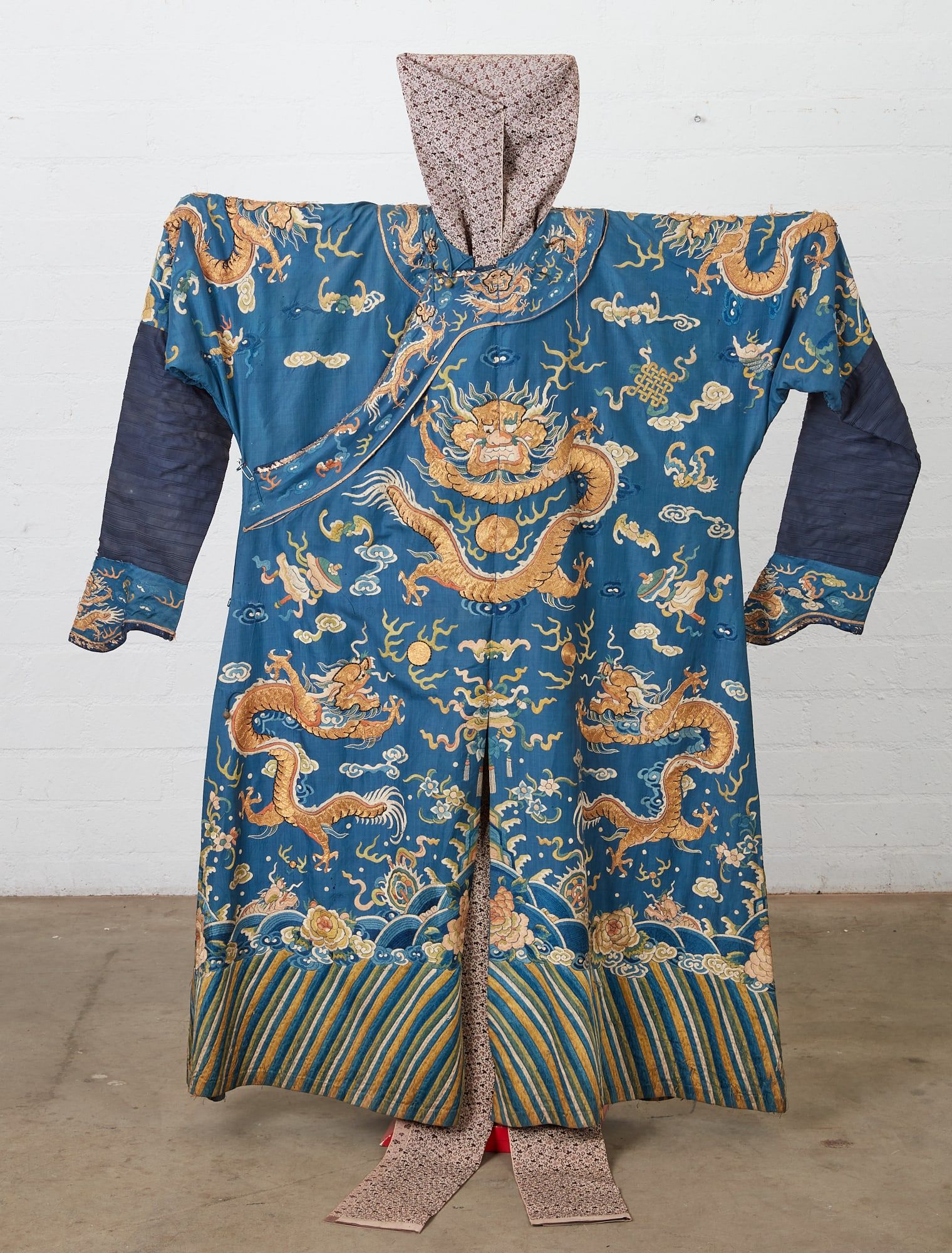 A CHINESE EMBROIDERED BLUE SILK DRAGON