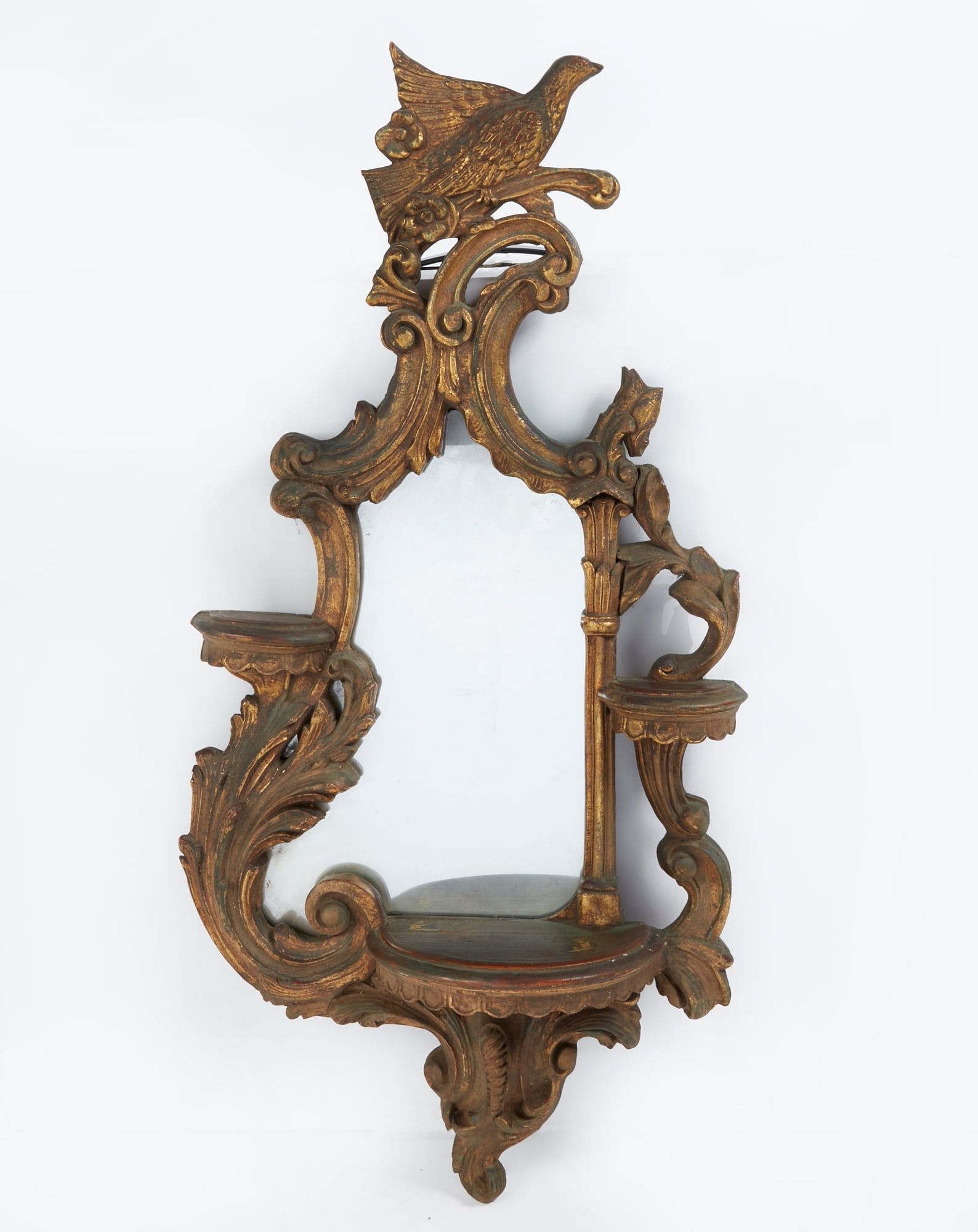 AN ITALIAN ROCOCO STYLE GILTWOOD MIRROR