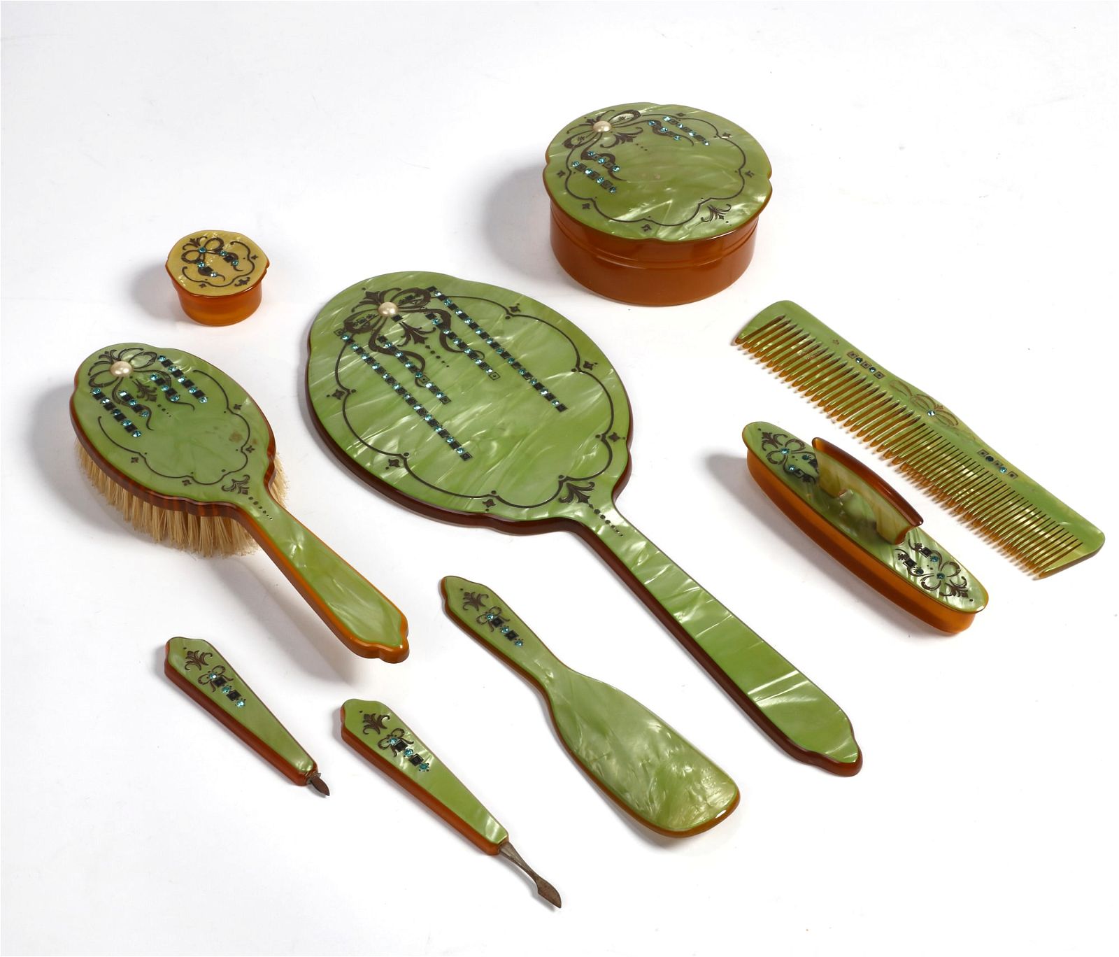 A VINTAGE GREEN CELLULOID DRESSING SETA