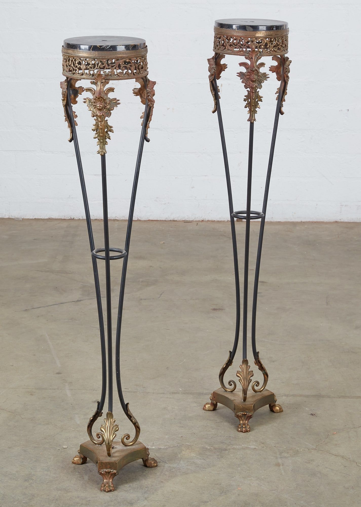 A PAIR OF GILT AND PATINATED METAL PEDESTALSA