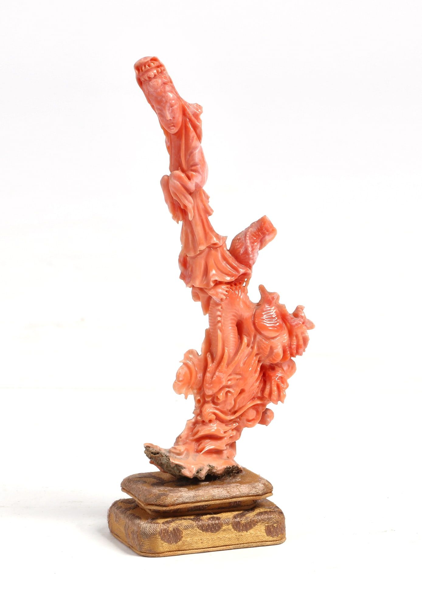 A CHINESE CARVED CORAL FIGUREA Chinese