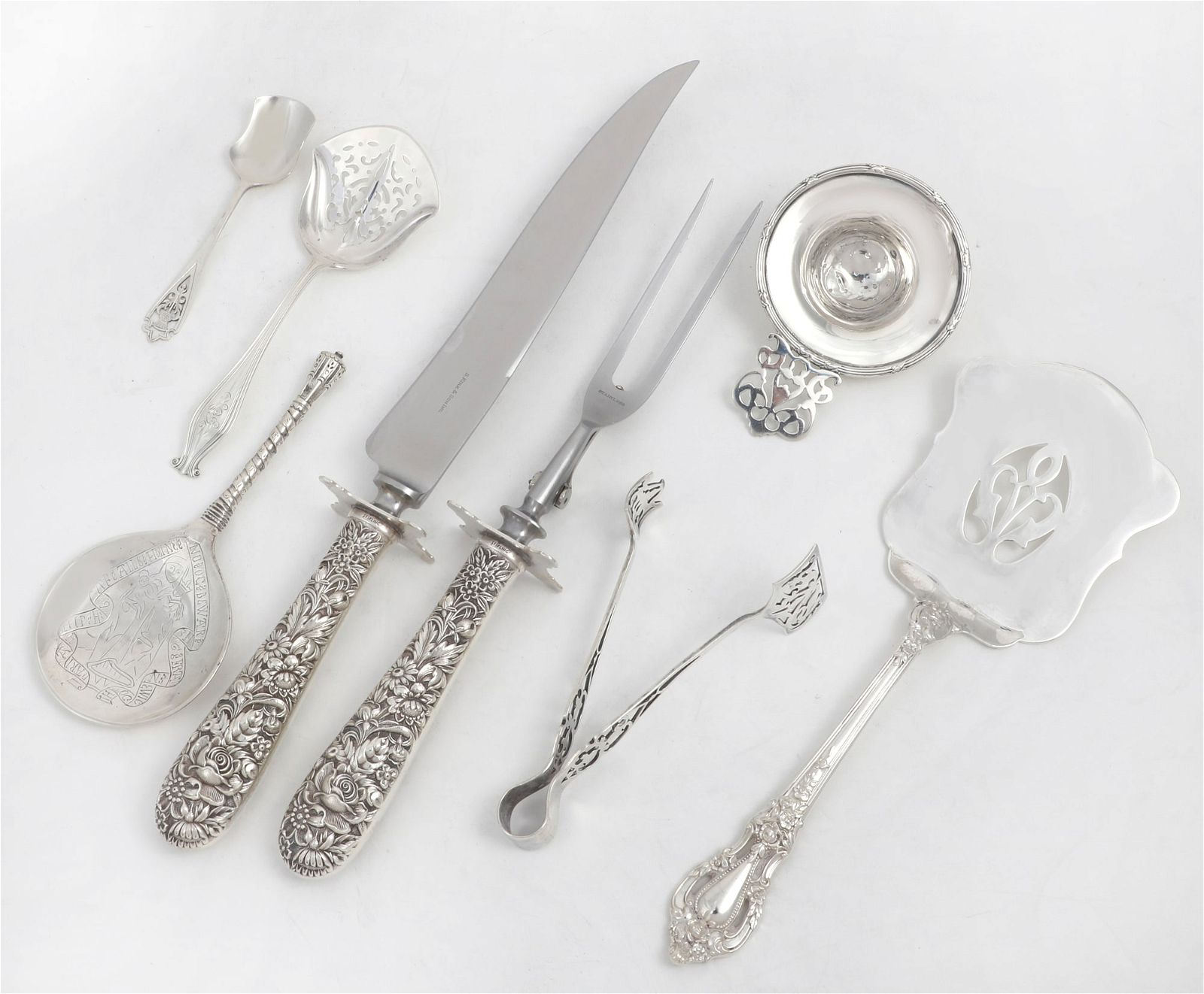 AN ASSEMBLED OF SILVER SERVING FLATWAREAn