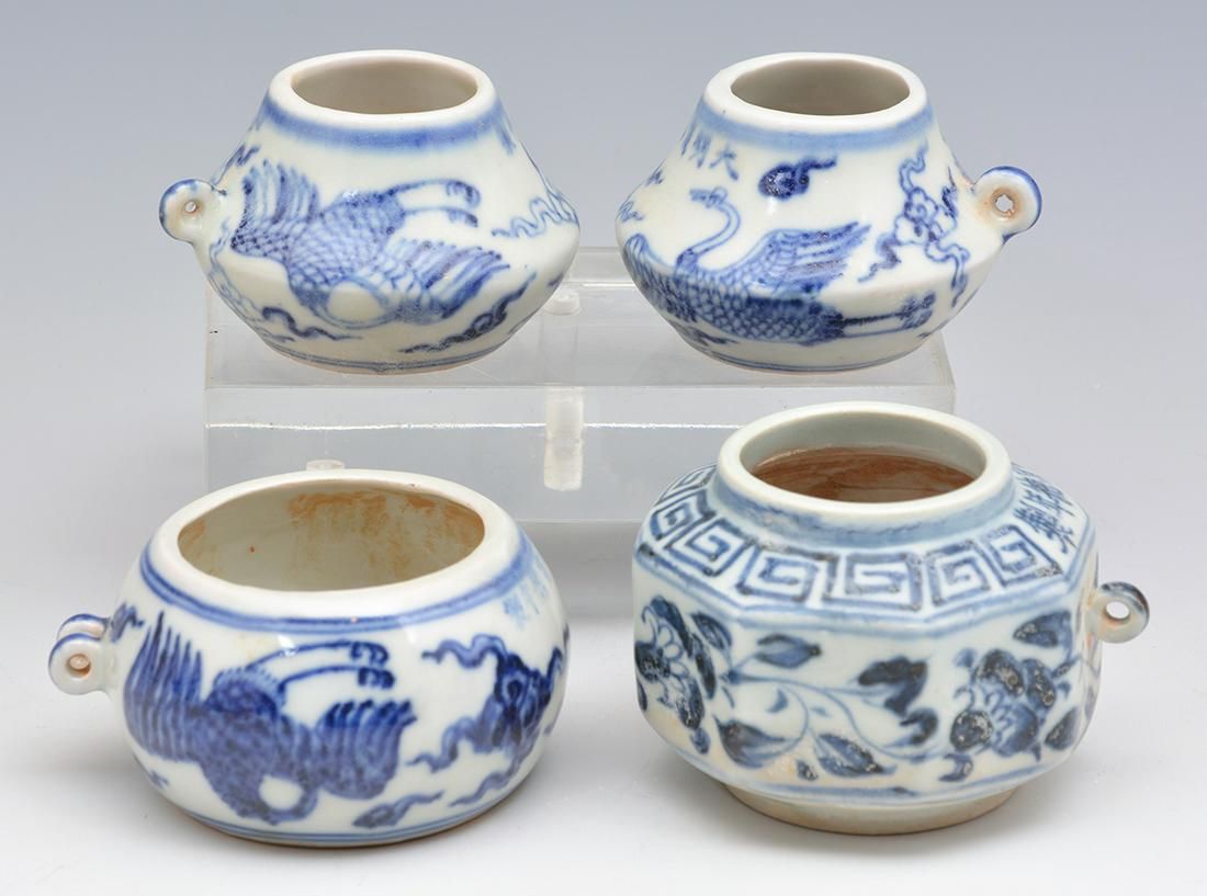 FOUR BLUE & WHITE PORCELAIN BIRD FEEDERSFour