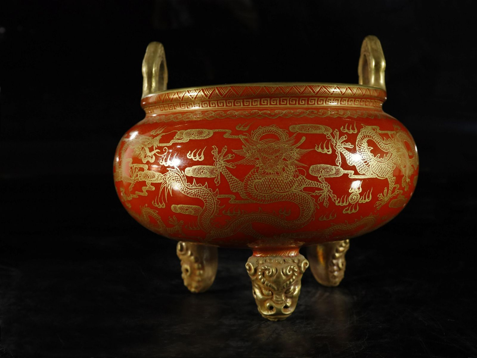 A RED GLAZED PAINTED GOLD DRAGON  3d0c0b