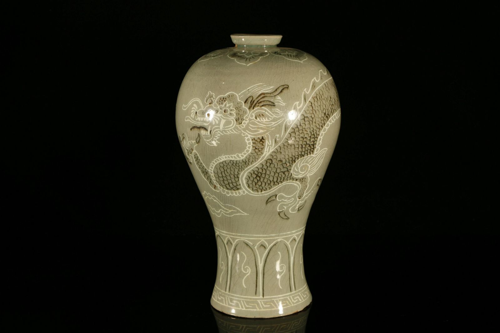 A RARE KOREAN CELADON-GLAZED 'DRAGON'