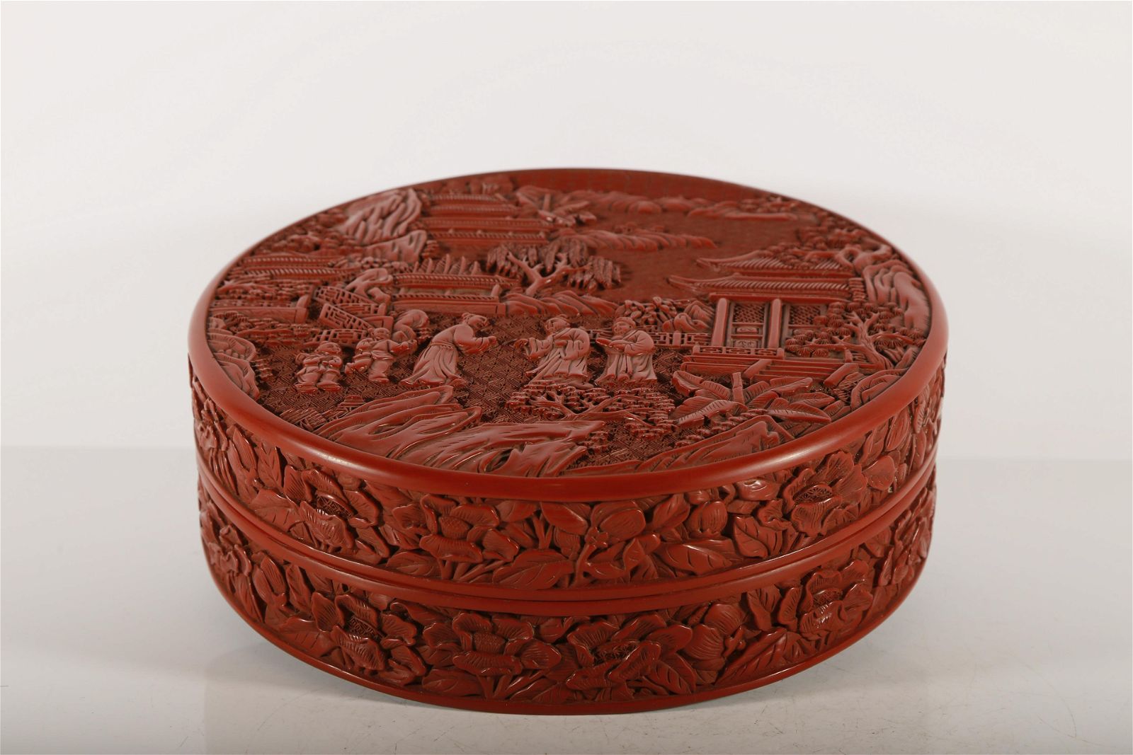 A FINE RED CARVED LACQUER FIGURE  3d0d83
