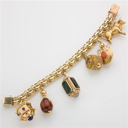 Gold Charm Bracelet
	  Estimate:$2,500-$3,500