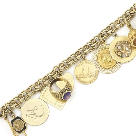 Gold Charm Bracelet
	  Estimate:$1,000-$1,500