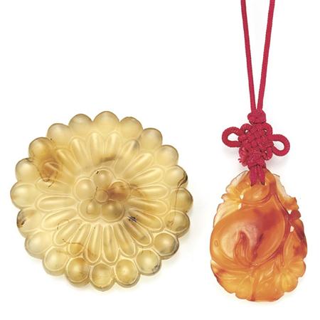 Two Carved Agate Pendants
	  Estimate:$75-$150